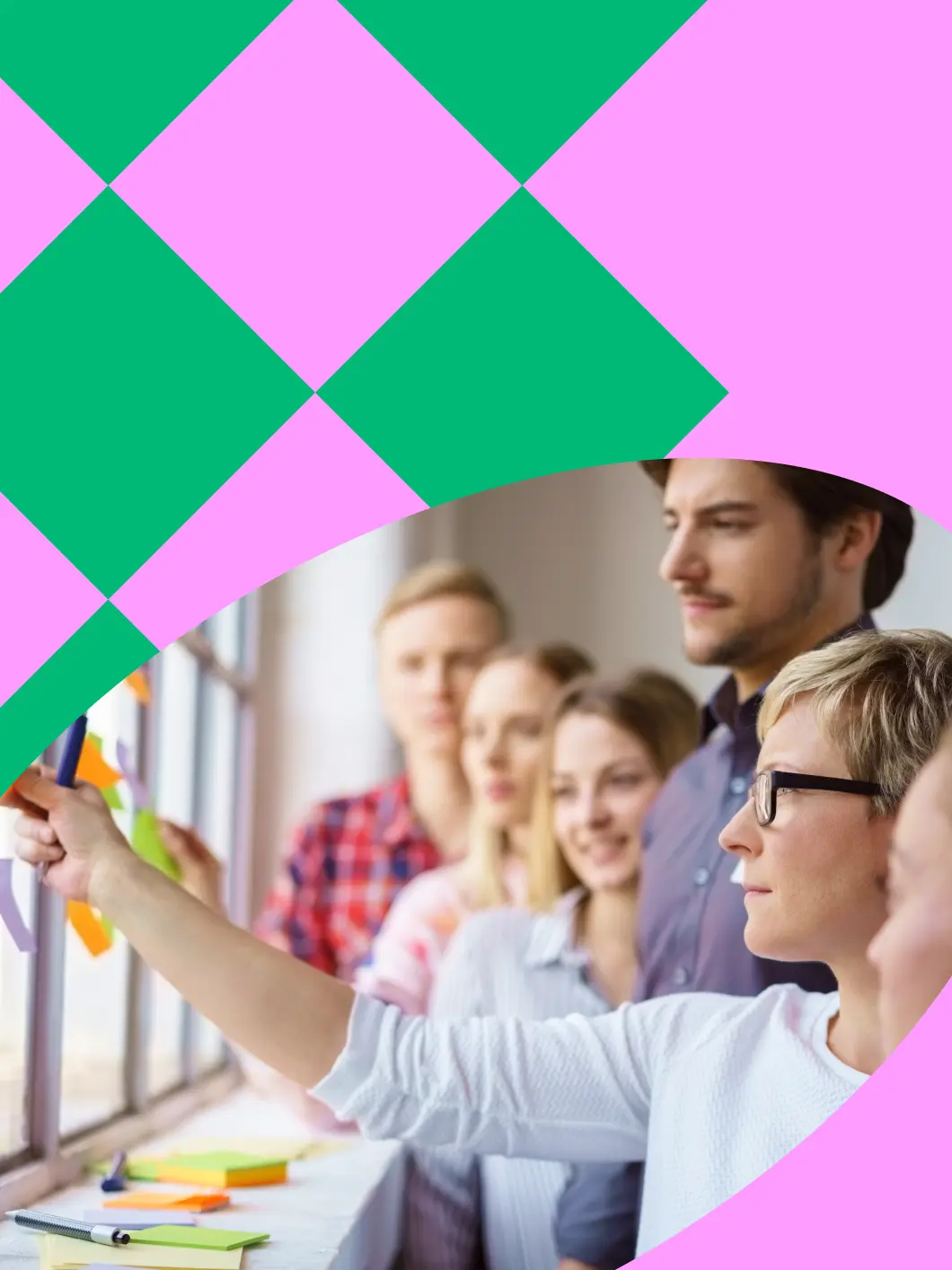 Team placing post-it notes on a window during a workshop