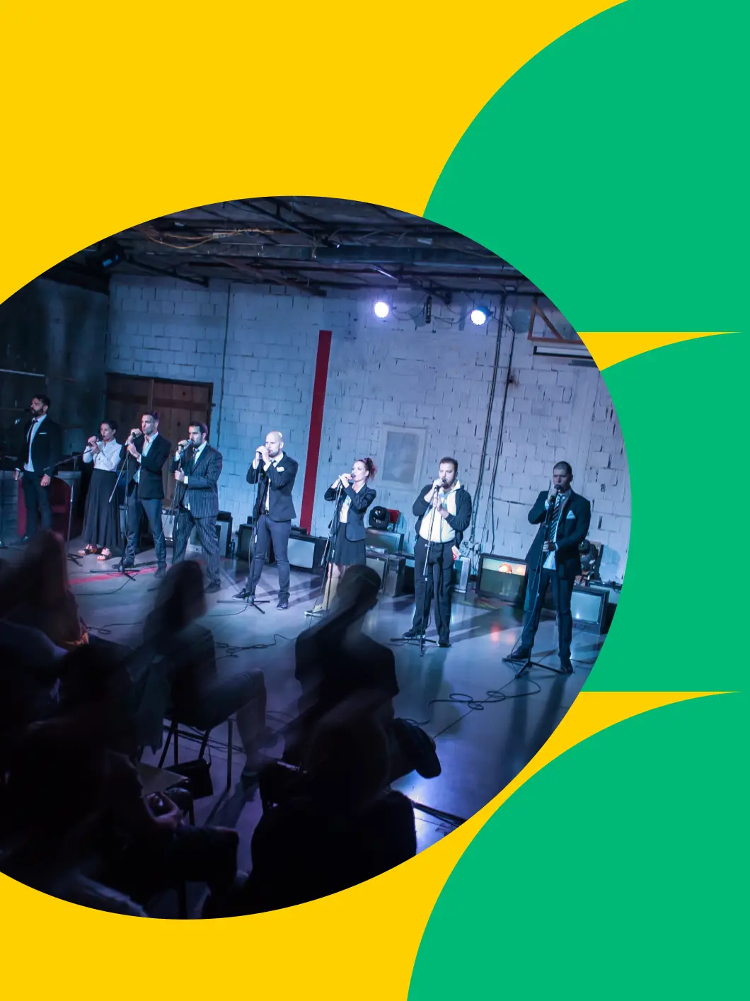 Business theater ensemble performing on a dramatically lit stage