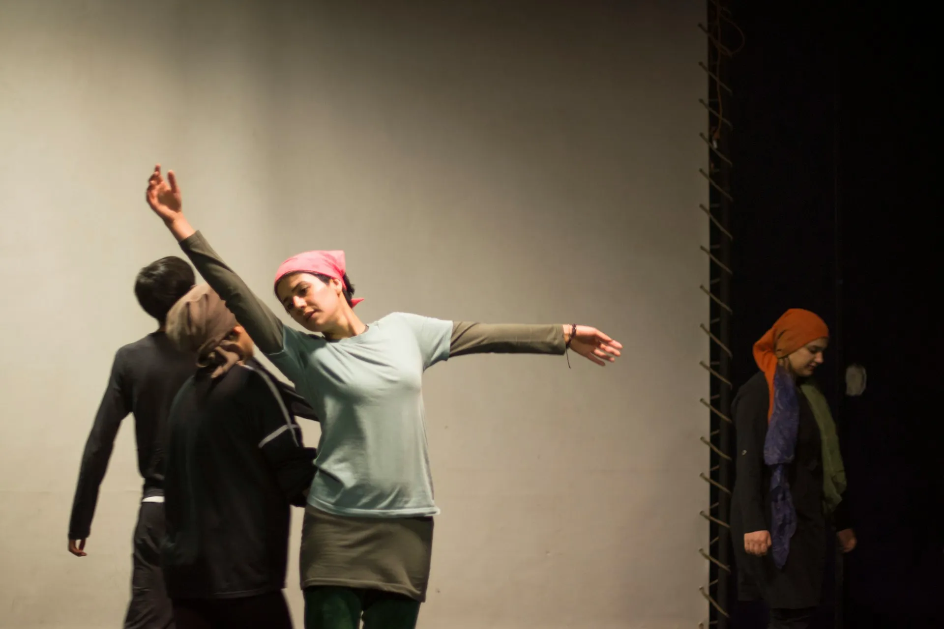 Actors performing a reaction from the organisation on stage